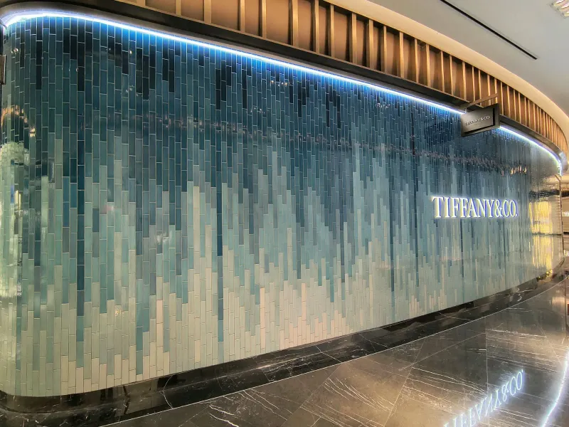 Facade detail with aqua-toned cladding