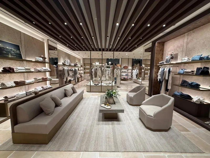 Boutique overview with a dark wood ceiling and central seating area