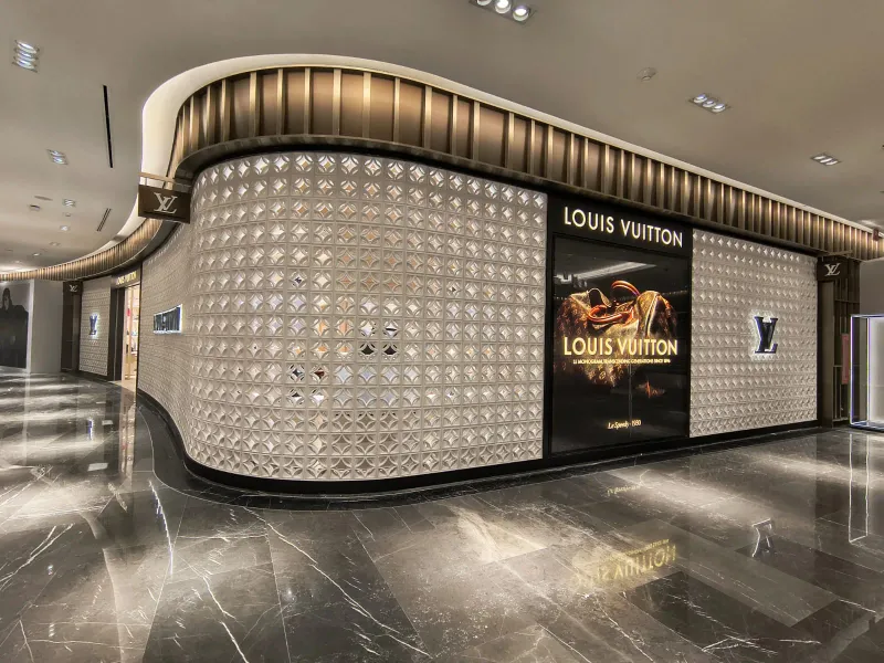 Curved Louis Vuitton facade with white latticework