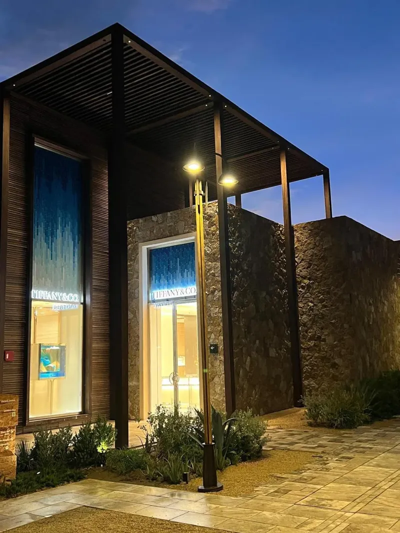 Entrance and display windows beneath the timber canopy